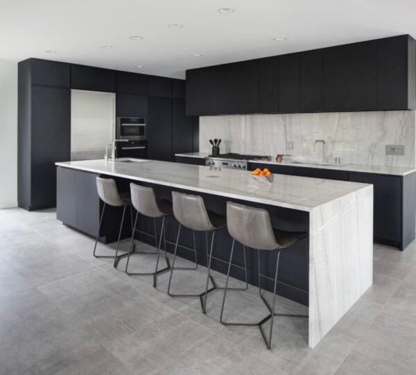 Black kitchen cabinet with white marble benchtop